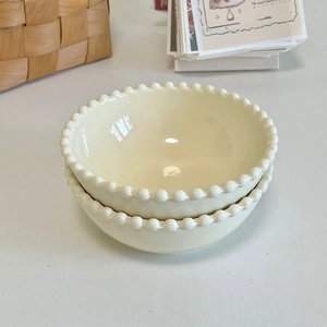 Minimalist cream white ceramic dessert bowls with beaded rim design and glossy finish