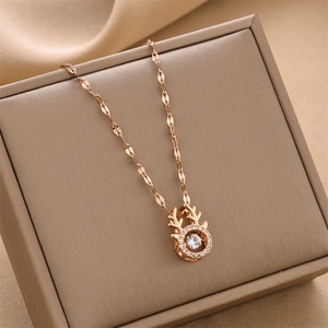Rose gold reindeer necklace with dancing zircon pendant on a luxury gift box