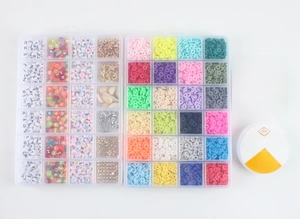 Flat lay of 48-grid DIY jewelry kit with clay beads, charms, and 0.8mm elastic strings