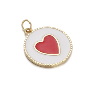 Detail of round gold pendant with white enamel background and a red heart charm