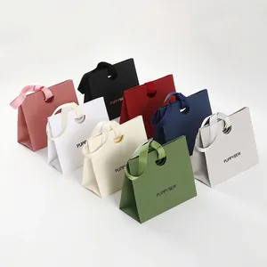 Colorful paper gift bags with satin ribbon handles in eight various colors by PUPPYSEW