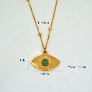Detail showing gold evil eye necklace dimensions 41+5cm with a green stone inlay