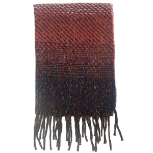 Detail view of colorful gradient scarf featuring knit texture and fringe accents