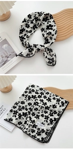 Detailed view of floral cotton linen square scarf with delicate black lace crochet trim