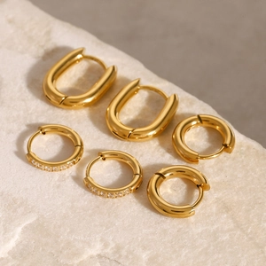 Three-pair set of gold stainless steel hoop earrings featuring plain and cubic zirconia styles