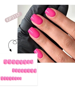 Detailed view of hot pink square press-on nails with glossy finish on hands and in array