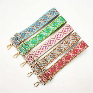 Close-up of five colorful ethnic style embroidered adjustable replacement bag straps