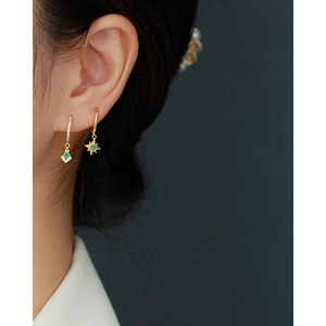 Gold s925 silver hoop earrings with star and geometric opal pendants on female model