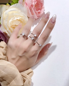 S925 silver rings with emerald, pear, square, and round cut moissanite on model's hand