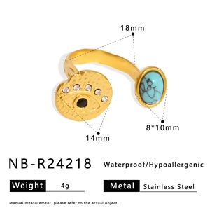 Detail view of gold stainless steel ring with blue stone and evil eye showing dimensions