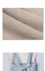 Detail of coral fleece hand towels and back bow tie on a blue striped waterproof apron