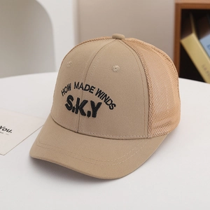 Detail of khaki mesh trucker hat showing high-quality embroidery and breathable fabric