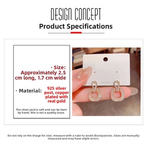 Macro detail of square gold-plated cubic zirconia earrings with 925 silver needles