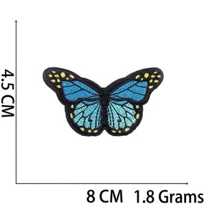 Detailed view of blue butterfly embroidered patch with dimensions 8cm x 4.5cm and dimensions