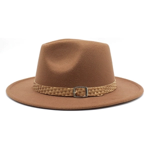 Detail of the brown fedora hat featuring a woven band and silver metal buckle closure