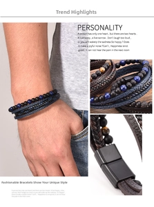 Macro detail of men's leather bracelet with tiger eye beads and black magnetic metal clasp