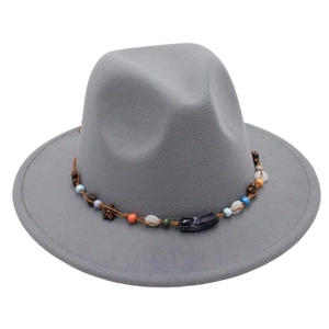 Detail of grey felt fedora featuring colorful ethnic beads and bronze flower charms