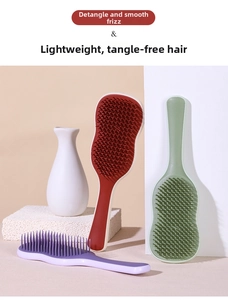 Ergonomic hairbrushes in multiple colors featuring flexible bristles for detangling hair