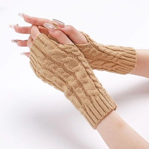 Close-up of cable knit texture on camel-colored fingerless gloves with ribbed cuffs