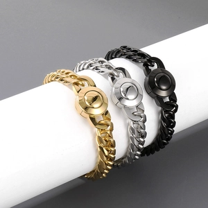 Three men's 11mm Cuban chain necklaces in gold, silver, and black polished stainless steel