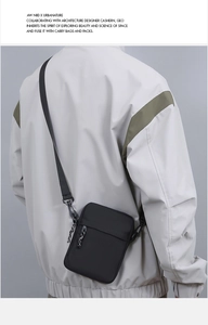 Rear view of minimalist black crossbody phone bag on model featuring adjustable strap