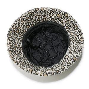 Detail of leopard bucket hat showing black quilted lining and adjustable drawstring
