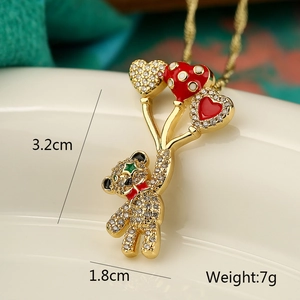 Detailed view of bear pendant with dimensions 3.2x1.8cm and 7g weight in gold finish