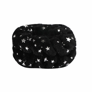 Detail of soft black plush scrunchie with shiny silver foil star patterns on white background