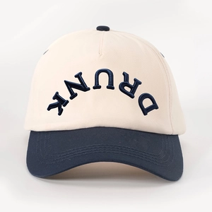 Detailed close-up of the 3D embossed DRUNK lettering on the color-block baseball cap