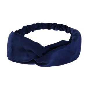 Detail of navy blue faux suede twisted headband with elastic band on white background