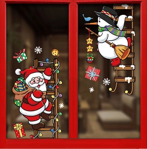 Close-up of festive window stickers featuring Santa Claus, snowman, and snowflakes