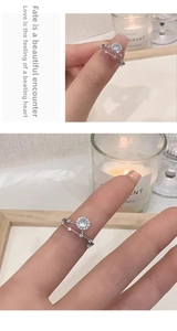 Detailed close-up of a double-layer S925 sterling silver ring featuring a round moissanite