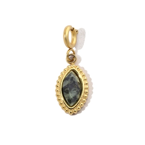 Macro view of marquise-shaped turquoise stone pendant in gold stainless steel setting