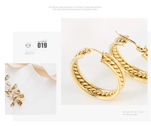 Detail of elegant gold hoop earrings with intricate inner twist design and smooth outer finish