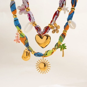 Bohemian multilayer necklace with 18K gold butterfly, shell, and heart pendants on fabric cord