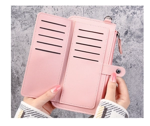 Detail view of pink long wallet interior showing multiple card slots and zipper pocket