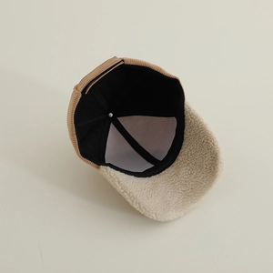 Internal view showing warm sherpa brim and corduroy texture of the kid's baseball cap