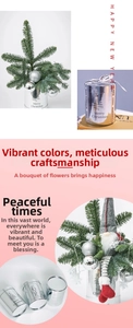 Detail of silver Merry Christmas flower bucket with cedar branches and a grey gnome doll
