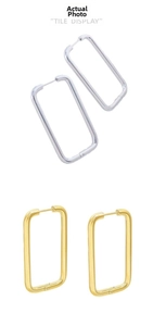 Close-up of gold and silver rectangle hoop earrings with high-polished metallic finish