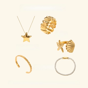 Collection of gold starfish pendants, heart rings, and hammer texture bangles set