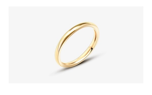 Detailed close-up of a polished rose gold titanium steel ring with smooth finish