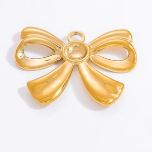 Detailed view of polished 18k gold butterfly bow pendant for jewelry making