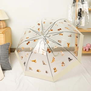 Transparent long handle umbrella with cute cat and dog patterns on a white rug
