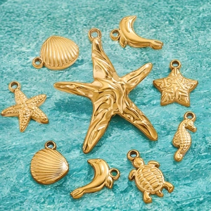 Golden stainless steel ocean pendants featuring starfish, sea turtles and shells on turquoise