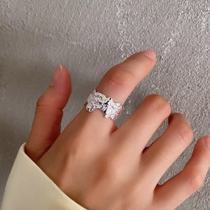 Macro shot of silver S925 ring featuring an irregular crumpled texture and lava-like finish