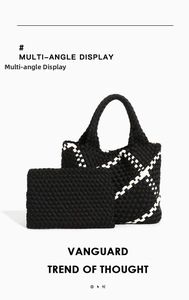 Detail of woven checkerboard tote set including a matching black inner clutch bag