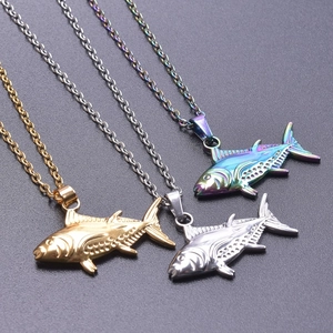 Three fish-shaped stainless steel pendants in gold, silver, and rainbow finishes on chains