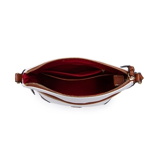 Top view of white crossbody bag showing multi-layer interior with red lining and brown trim