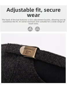 Macro detail of dark grey beret with adjustable bronze buckle and knit texture