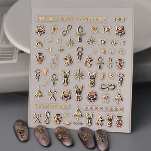Detailed 3D embossed nail stickers featuring gold Egyptian motifs and Eye of Horus symbols